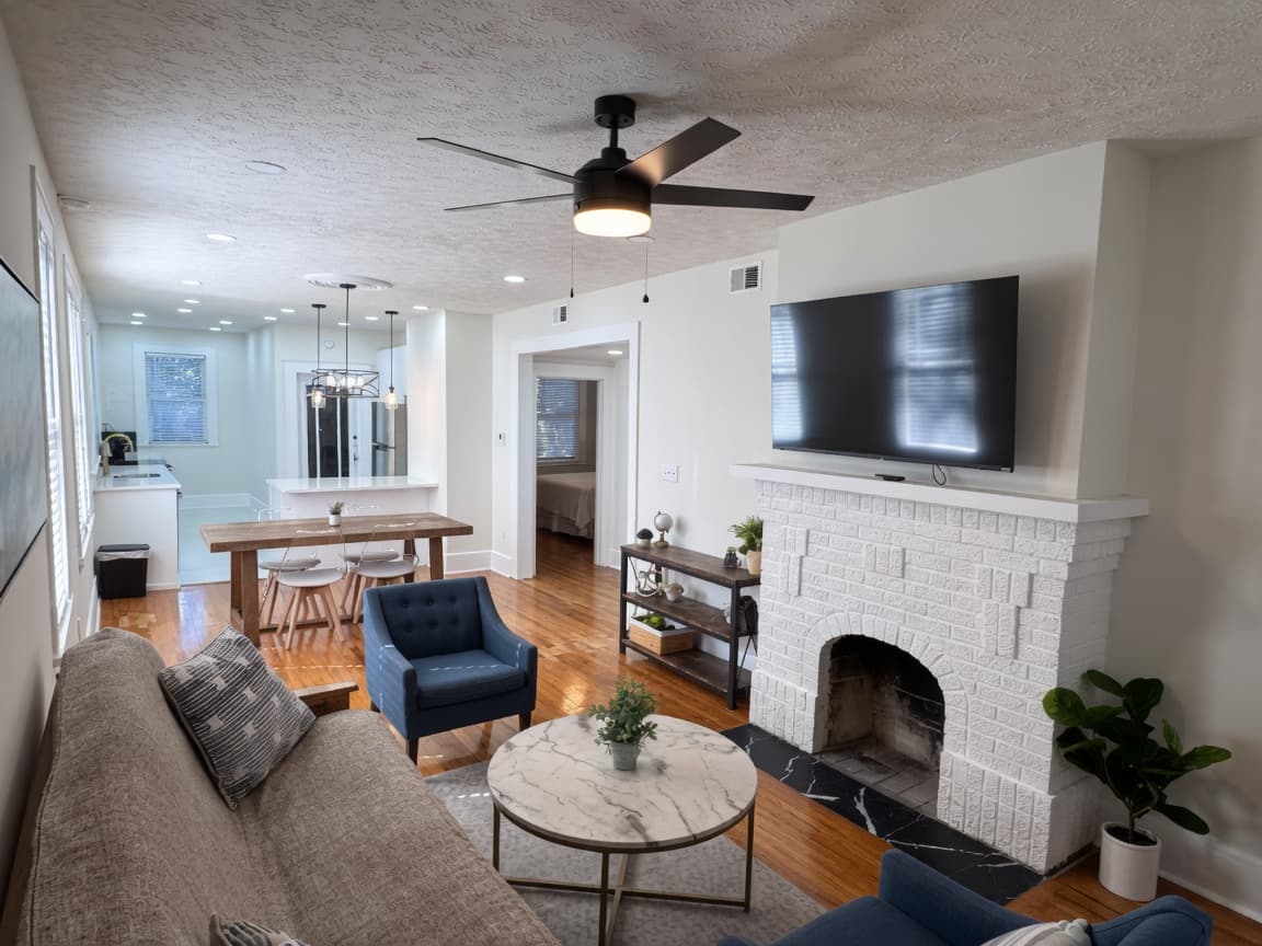The Avondale House — Historic Haven side: living room with fireplace